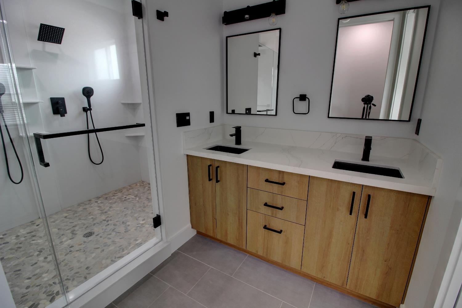 1526 3rd Street Escalon, CA 95320 - Photo 43 of 44 a bathroom with a double vanity sink mirror and double