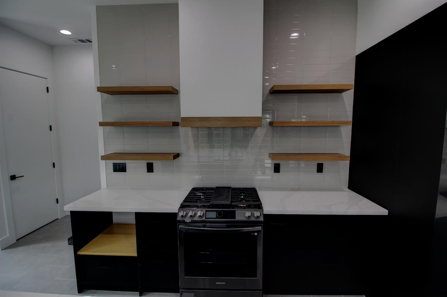1526 3rd Street Escalon, CA 95320 - Photo 7 of 44 a kitchen with a stove and a refrigerator