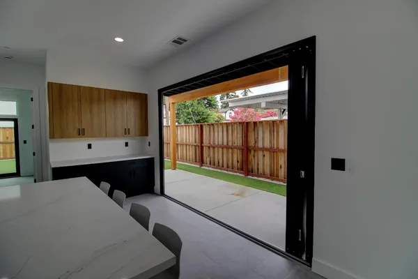 a view of room with wooden floor and a window