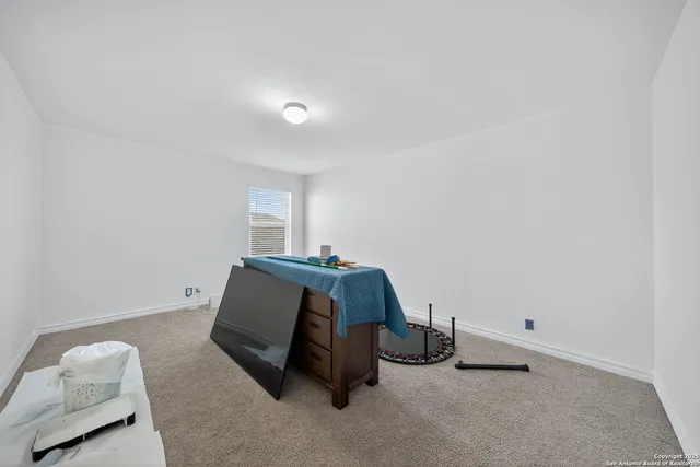 a room with a bed and a window