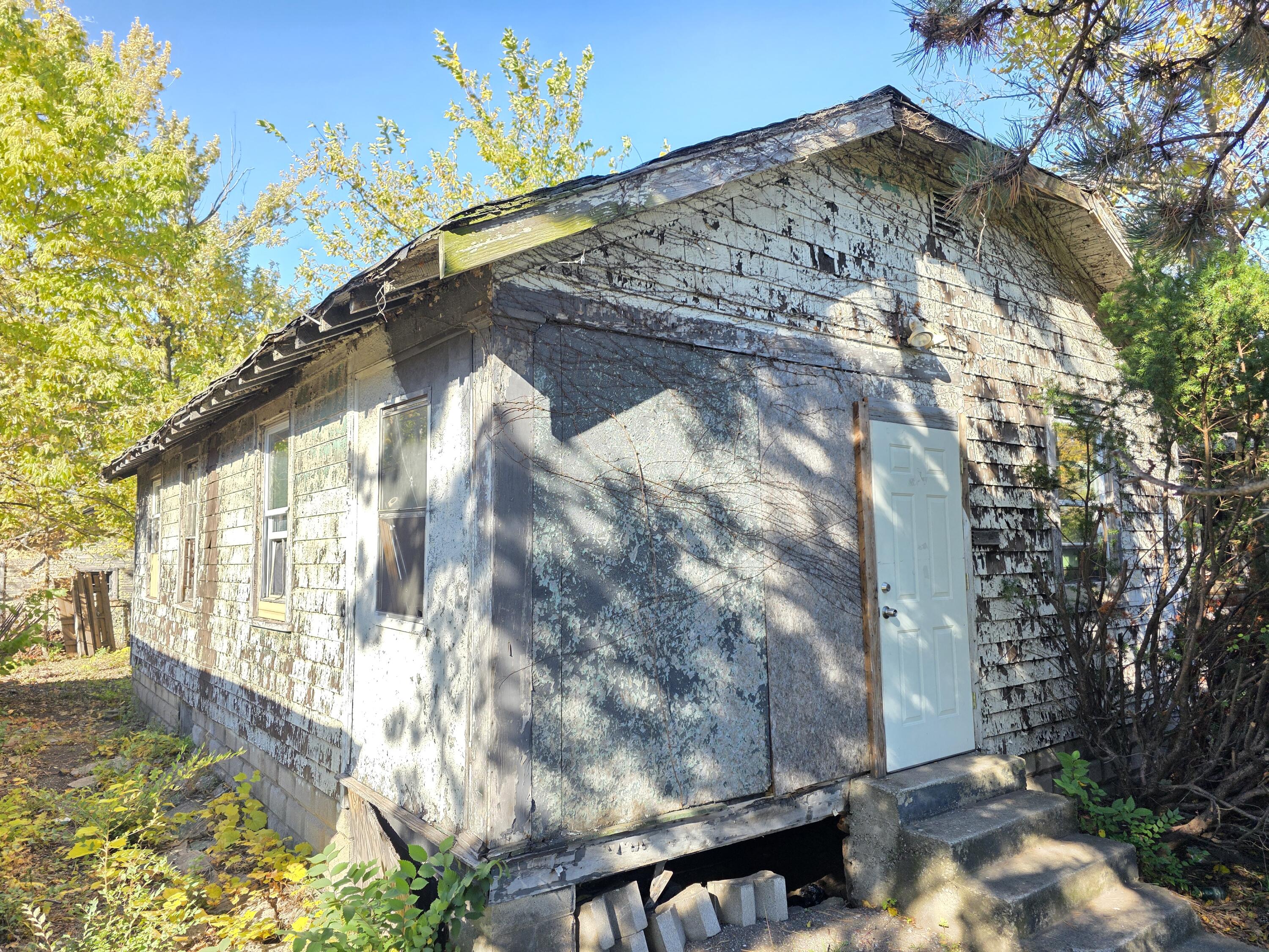 772 Ohio Street Gary, IN 46402 - Photo 14 of 22 a view of a yard with a tree