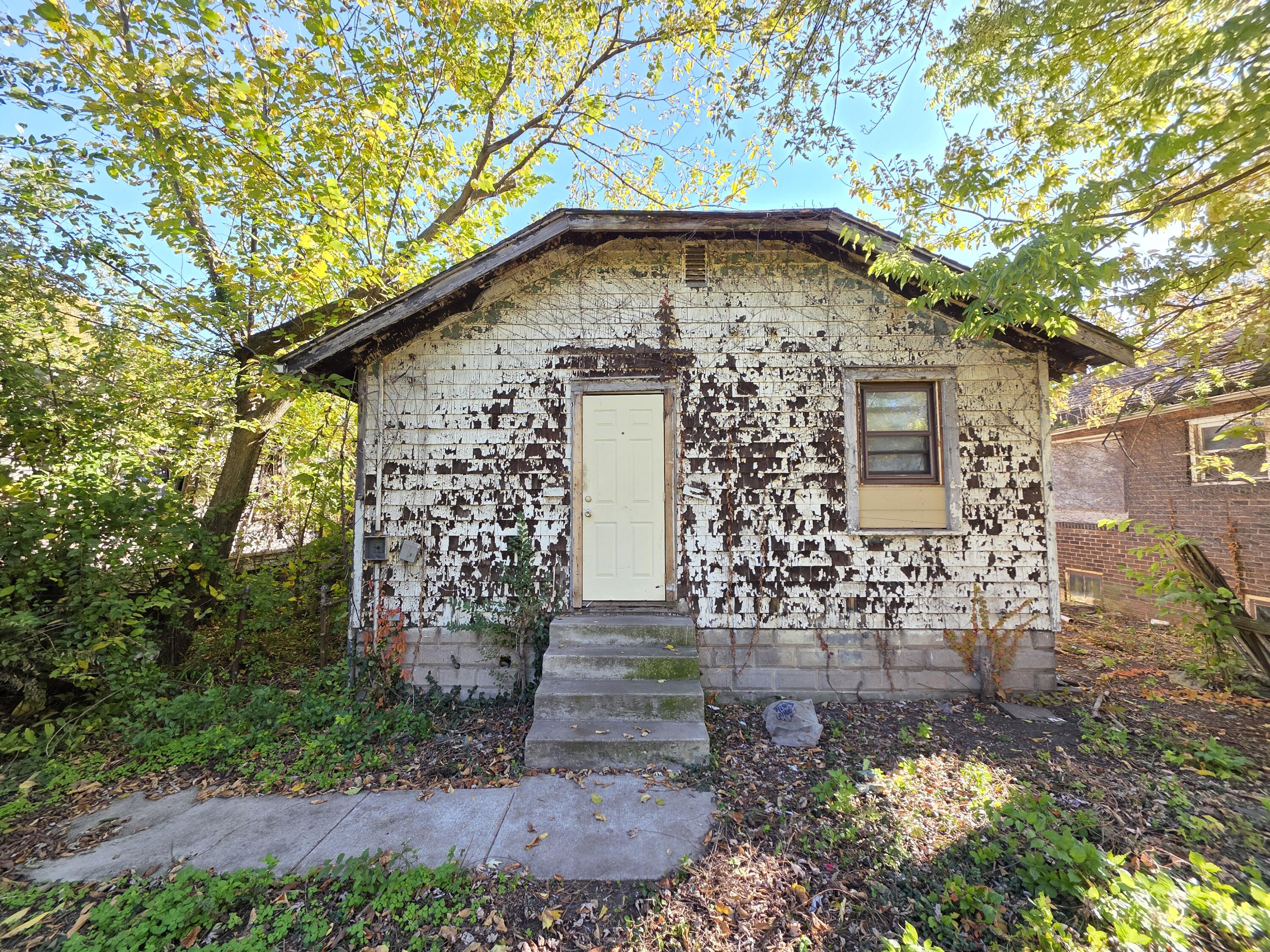 772 Ohio Street Gary, IN 46402 - Photo 2 of 22 a front view of a house with garden