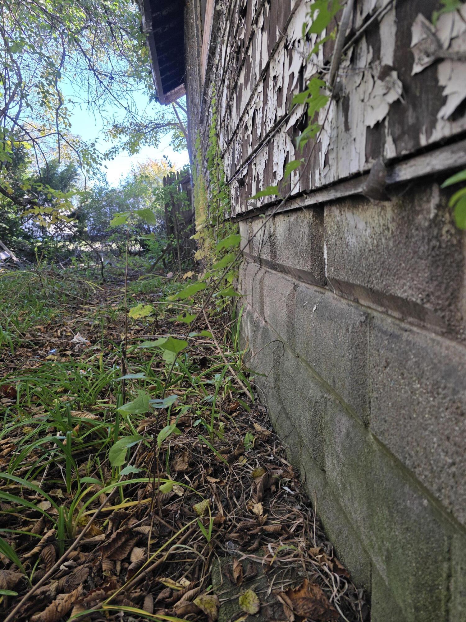 772 Ohio Street Gary, IN 46402 - Photo 10 of 22 a view of a yard with wooden fence