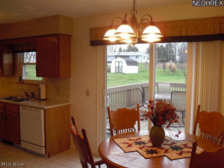 6250 Dodge Road Southwest Canton, OH 44706 - Photo 10 of 25 Sliding doors lead to the deck