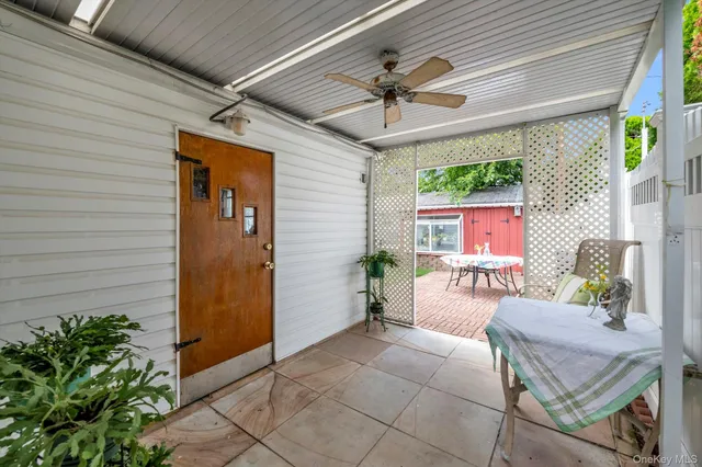a outdoor space with the ceiling fan