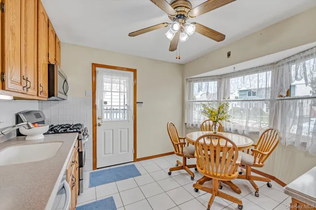 a dining room with furniture and window