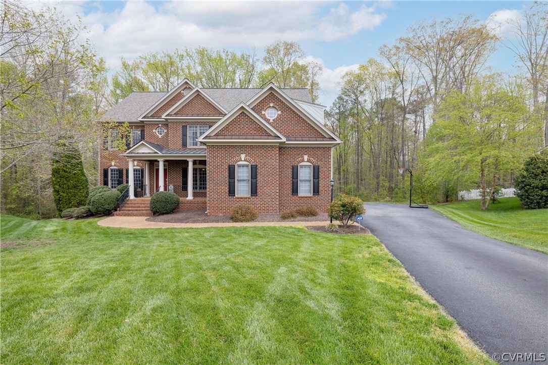 13201 Tipple Point Road Midlothian, VA 23114 - Photo 1 of 50 a front view of a house with yard and green space