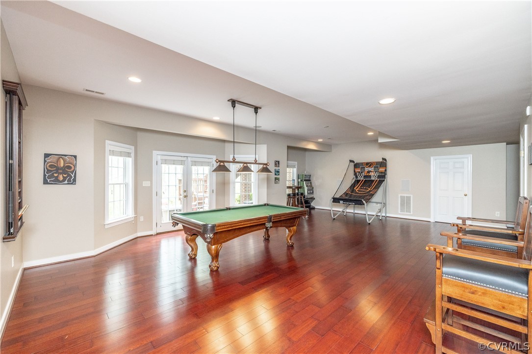 13201 Tipple Point Road Midlothian, VA 23114 - Photo 36 of 50 a view of a living room a dining table chairs wooden floor and a large window