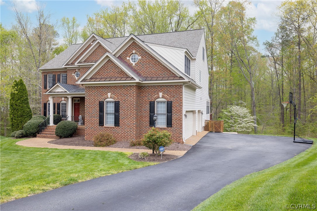 13201 Tipple Point Road Midlothian, VA 23114 - Photo 42 of 50 a front view of a house with garden