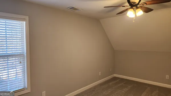a kitchen with refrigerator and microwave
