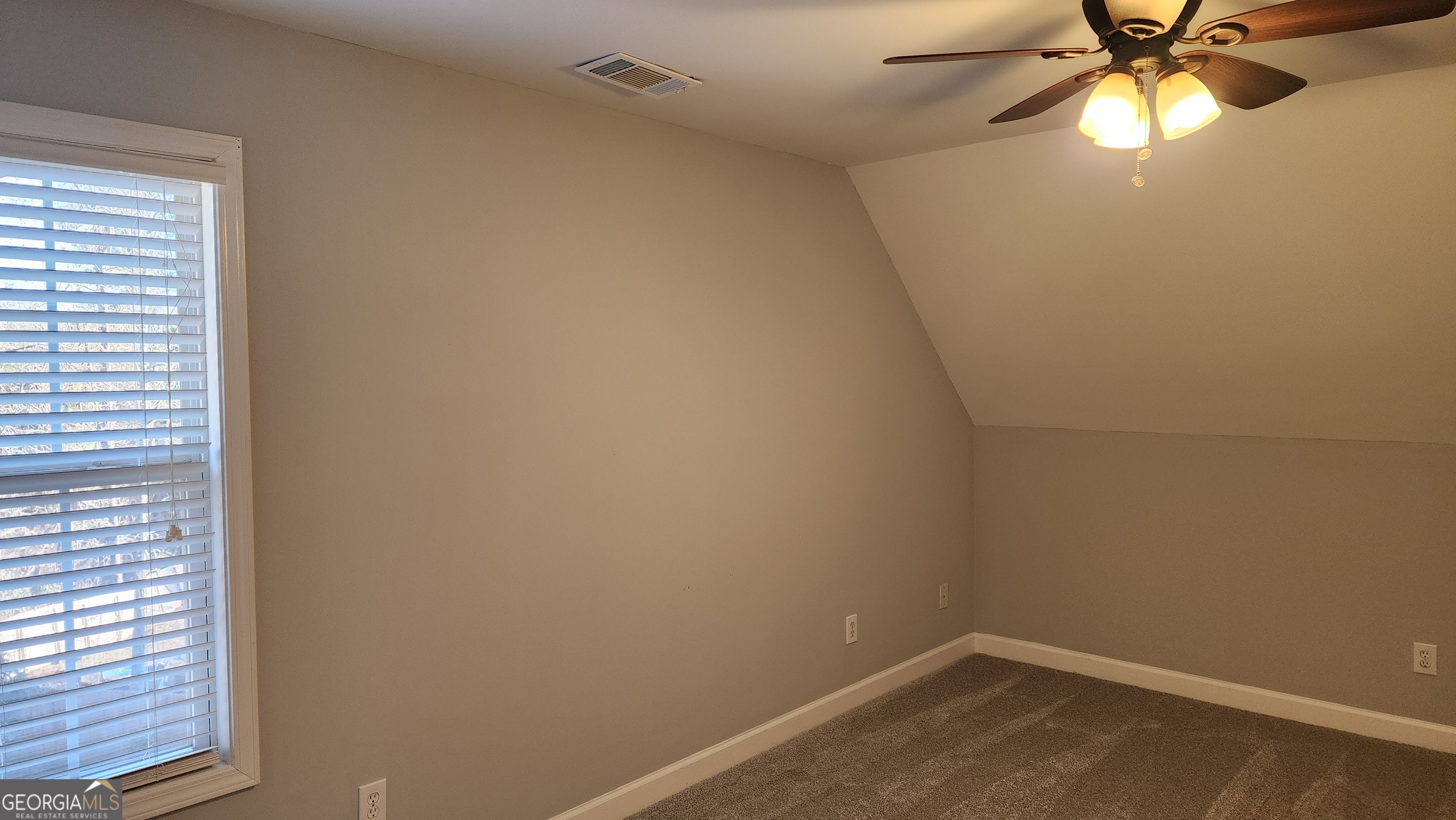 12123 Edgewater Drive Hampton, GA 30228 - Photo 23 of 44 a small space with a window and a fan