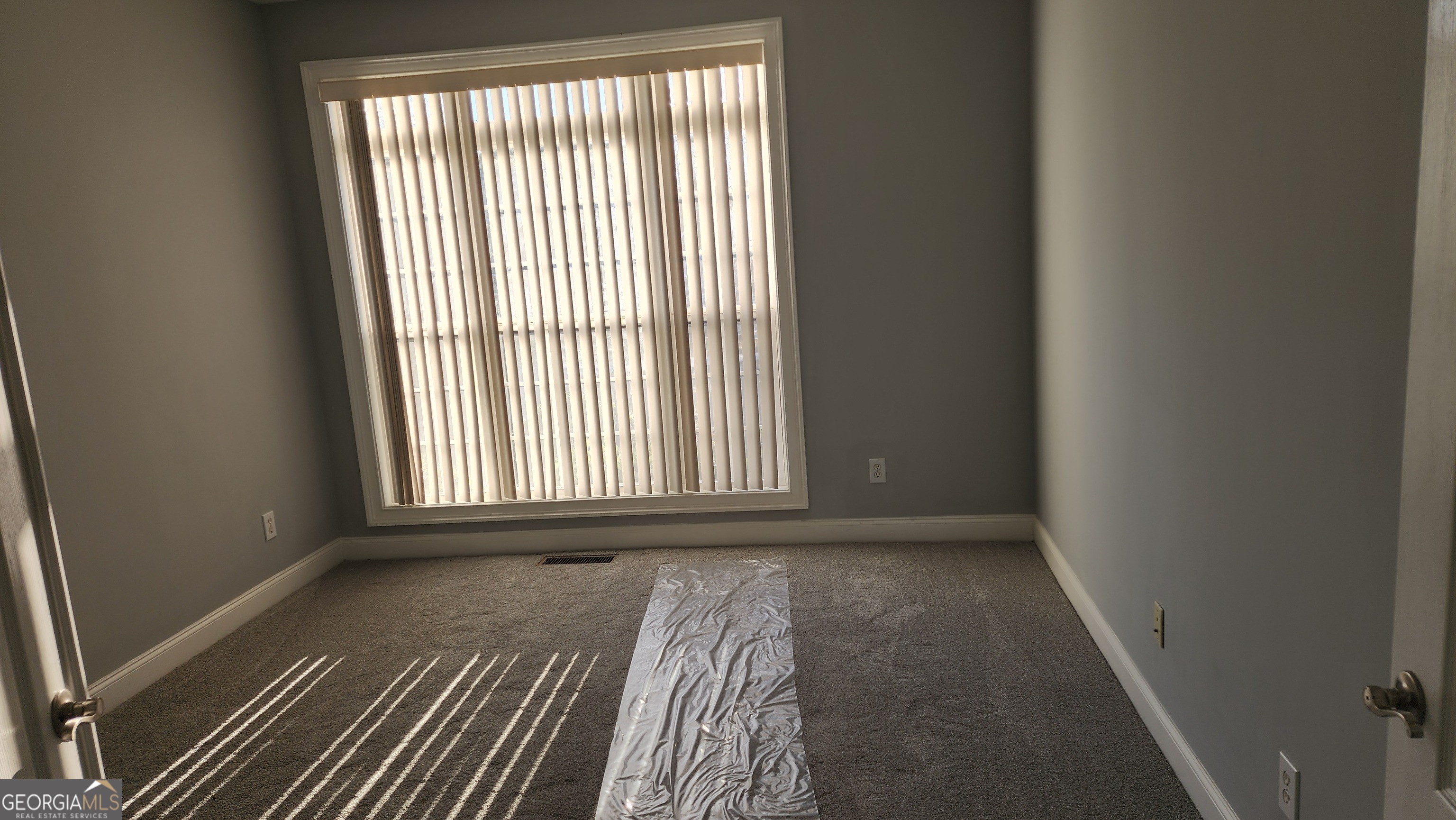 12123 Edgewater Drive Hampton, GA 30228 - Photo 24 of 44 a view of a room with wooden floor and a window