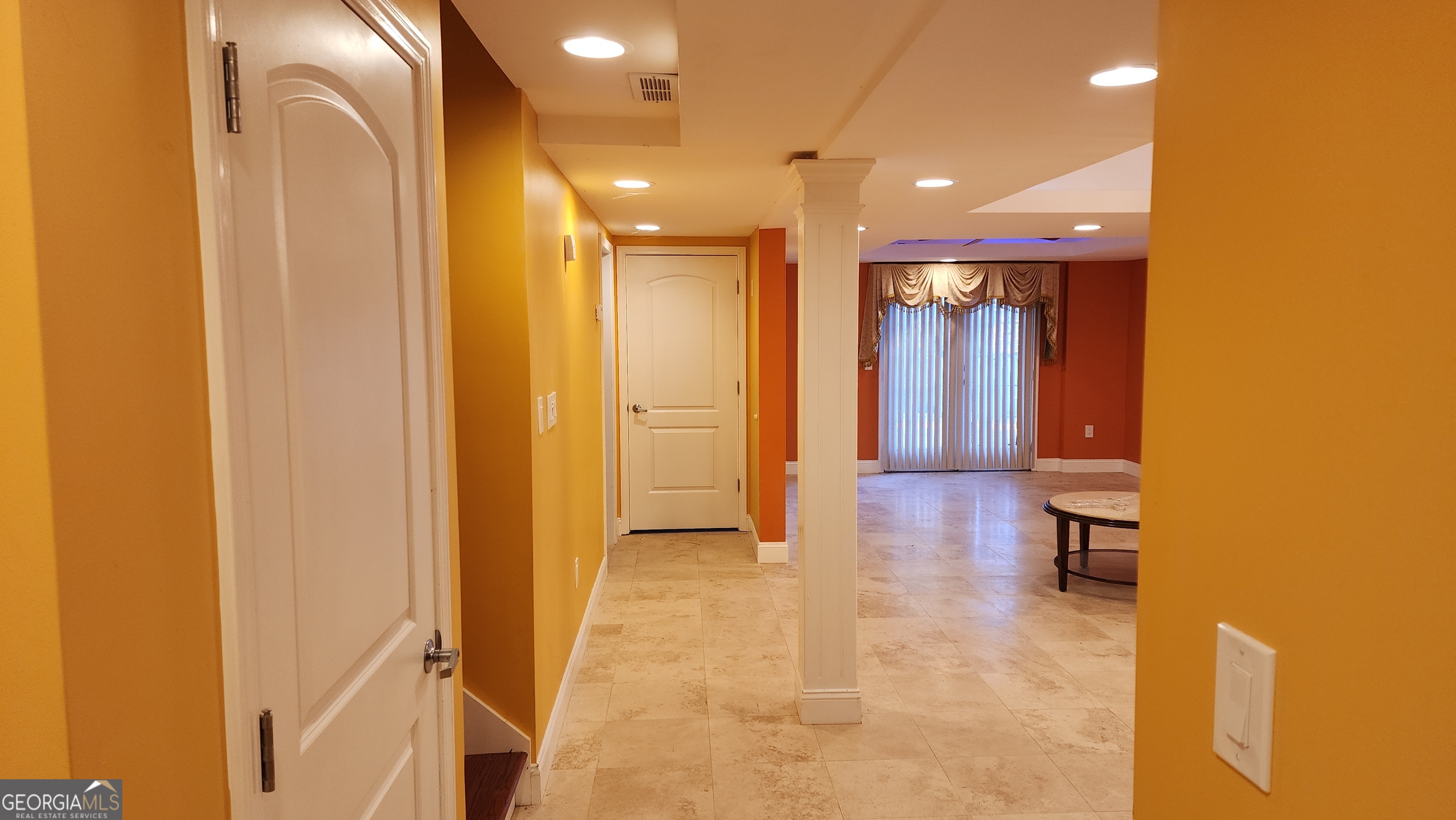 12123 Edgewater Drive Hampton, GA 30228 - Photo 28 of 44 a view of hallway with bathroom and wooden floor