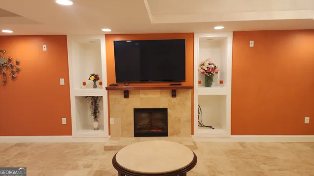 a kitchen with stainless steel appliances granite countertop a refrigerator a sink and a stove