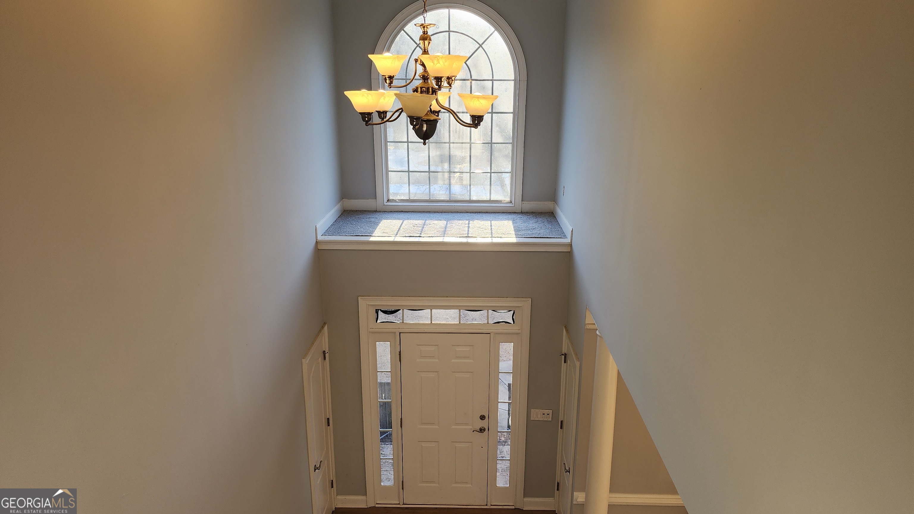 12123 Edgewater Drive Hampton, GA 30228 - Photo 6 of 44 a view of staircase with wooden door