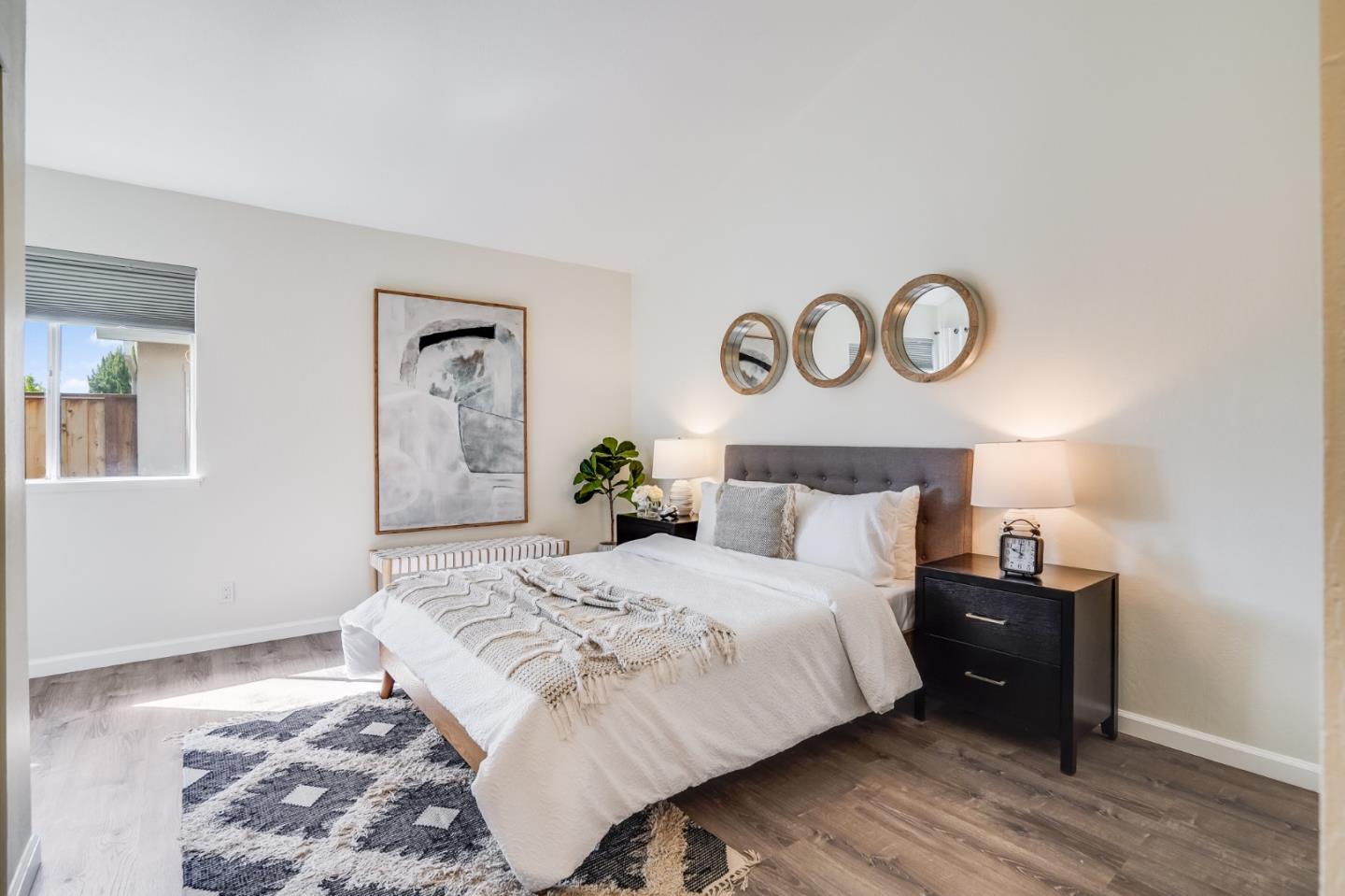 713 Comet Drive Foster City, CA 94404 - Photo 12 of 26 a bedroom with a bed and painting on the wall