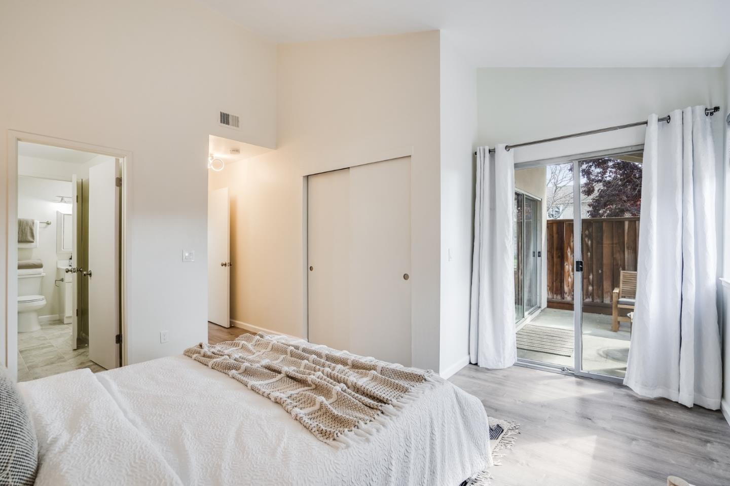 713 Comet Drive Foster City, CA 94404 - Photo 14 of 26 a bedroom with a bed and a mirror