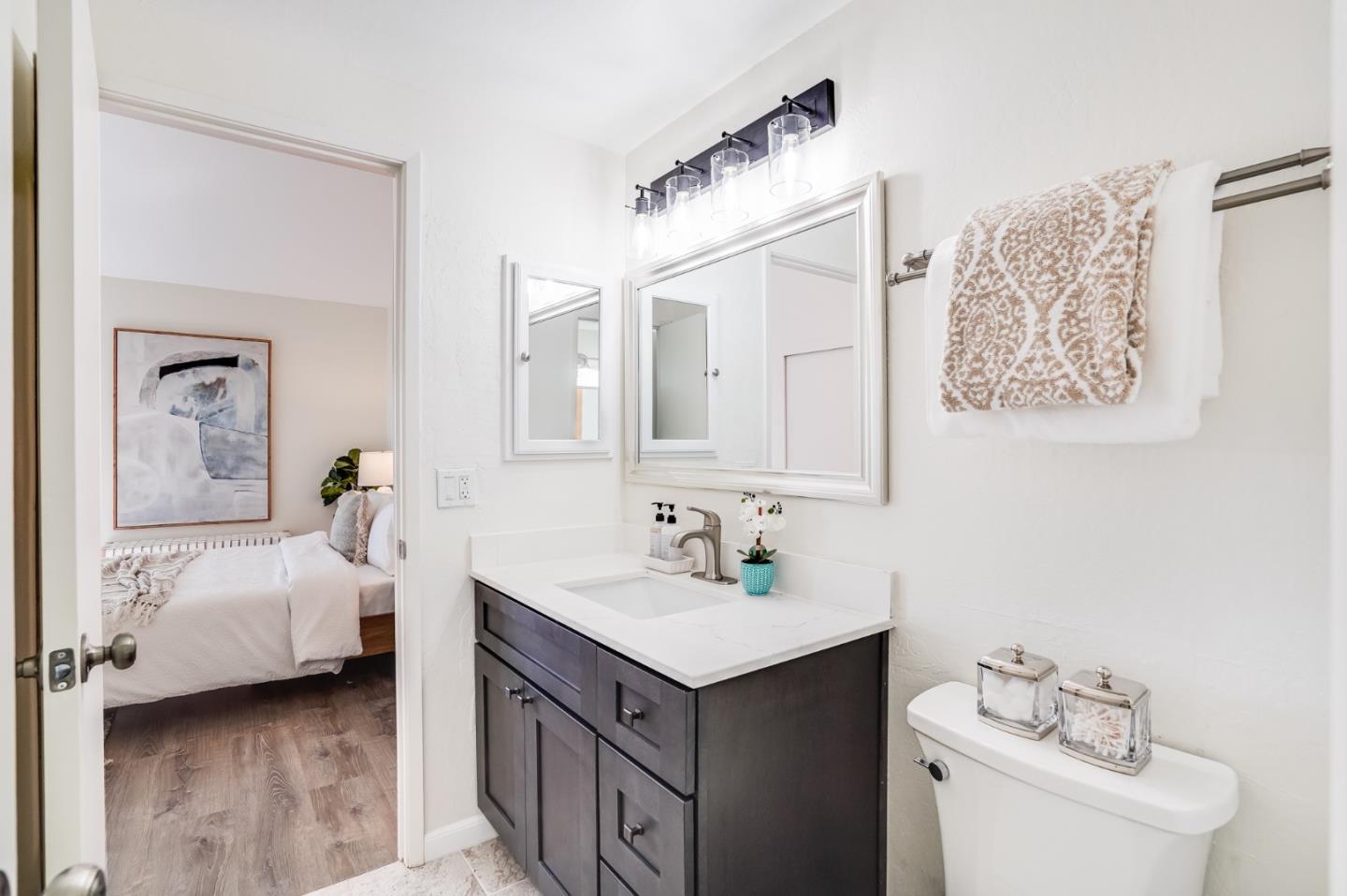 713 Comet Drive Foster City, CA 94404 - Photo 17 of 26 a en suite bathroom with a double vanity sink and a mirror