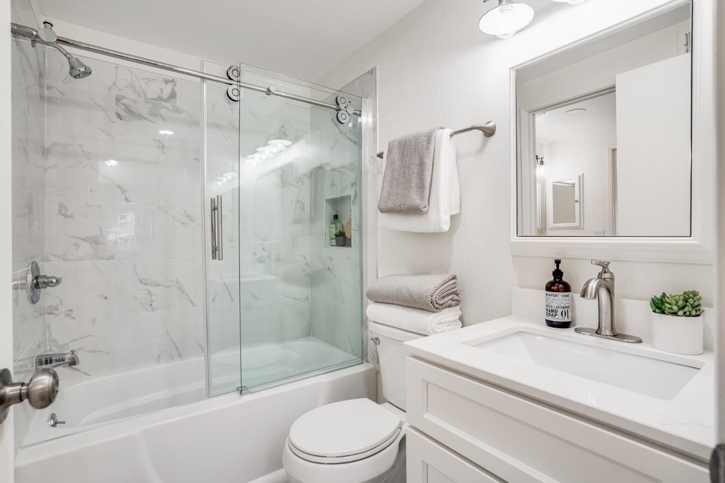 713 Comet Drive Foster City, CA 94404 - Photo 19 of 26 a bathroom with a sink toilet and shower