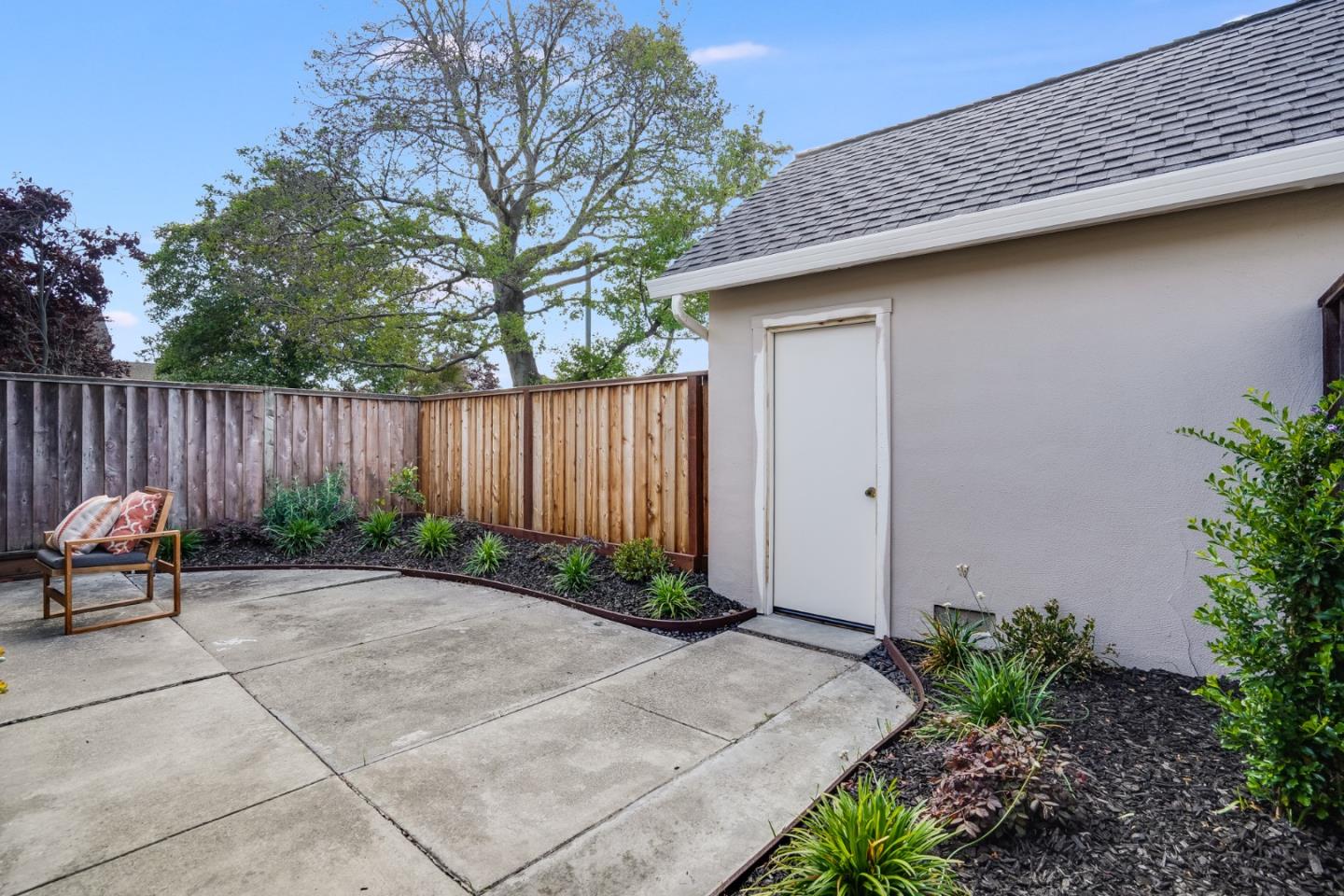 713 Comet Drive Foster City, CA 94404 - Photo 22 of 26 a bench is sitting in middle of garden