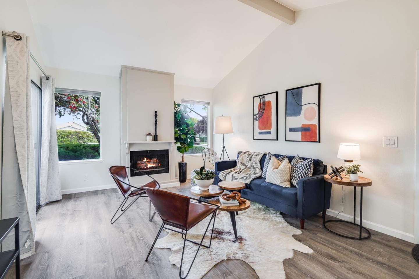 713 Comet Drive Foster City, CA 94404 - Photo 5 of 26 a living room with furniture a fireplace and a window