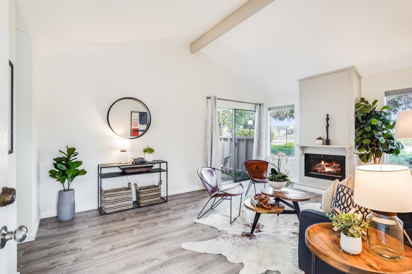 713 Comet Drive Foster City, CA 94404 - Photo 7 of 26 a living room with fireplace furniture and a potted plant