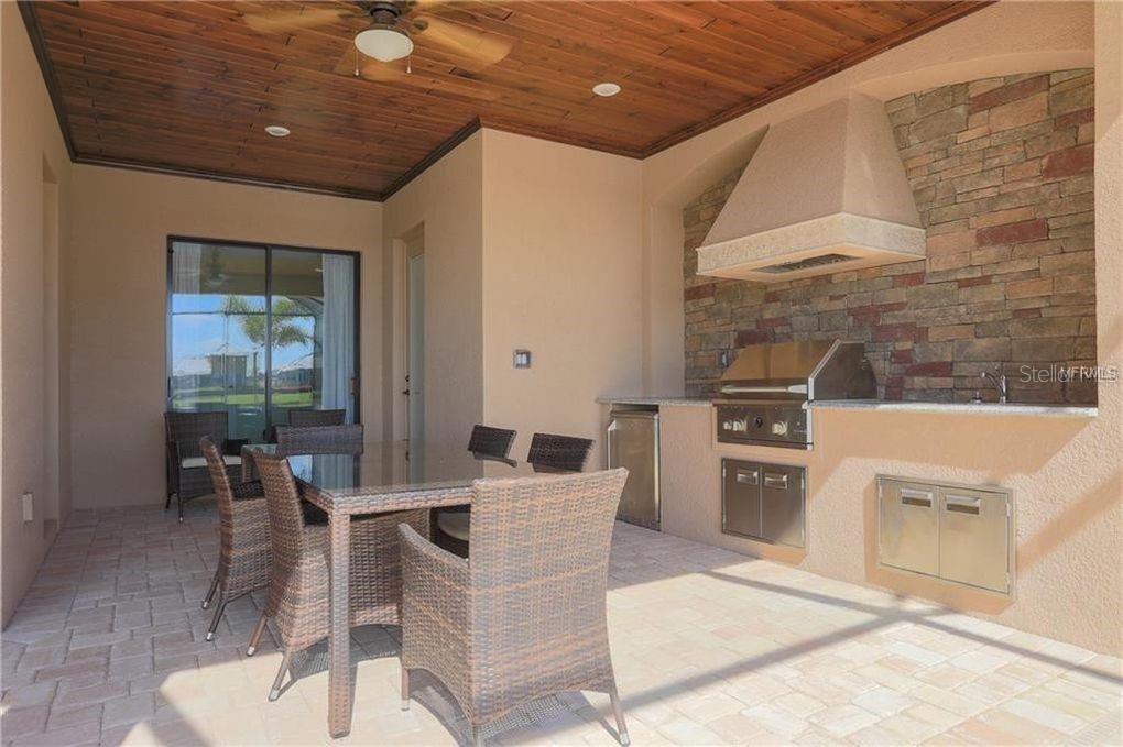 5528 Arnie Loop Lakewood Ranch, FL 34211 - Photo 24 of 59 a outdoor dining space with furniture