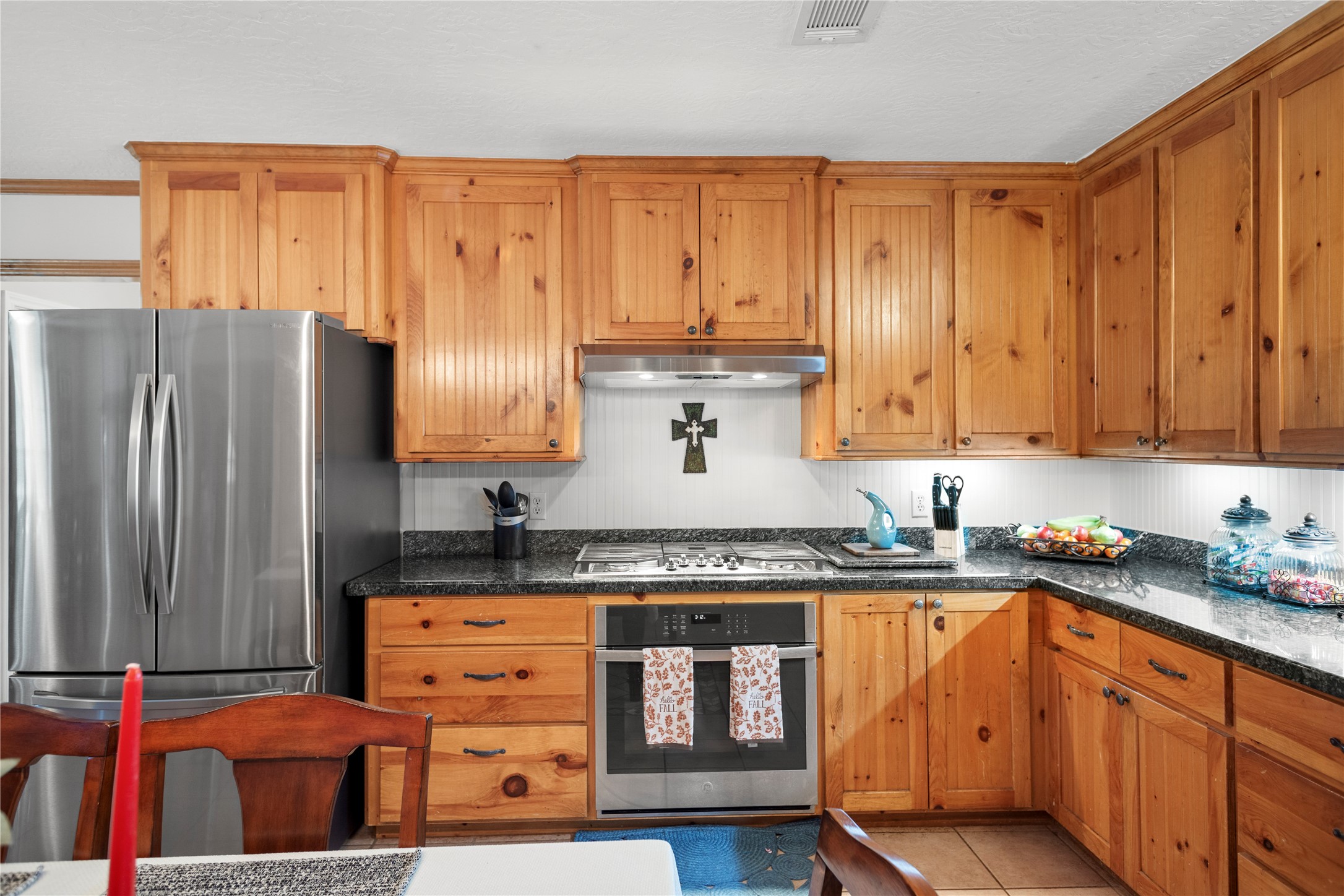 7875 Willys Road New Waverly, TX 77358 - Photo 11 of 45 a kitchen with stainless steel appliances granite countertop a refrigerator and sink