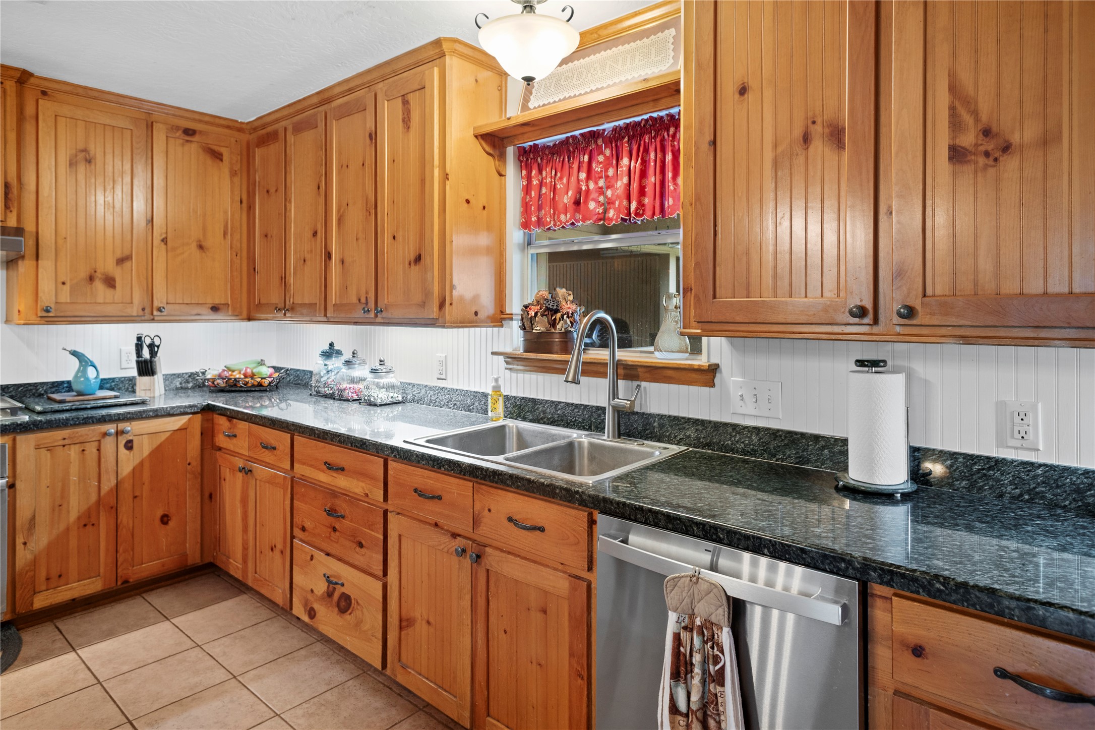 7875 Willys Road New Waverly, TX 77358 - Photo 12 of 45 a kitchen with stainless steel appliances granite countertop a sink a stove and cabinets