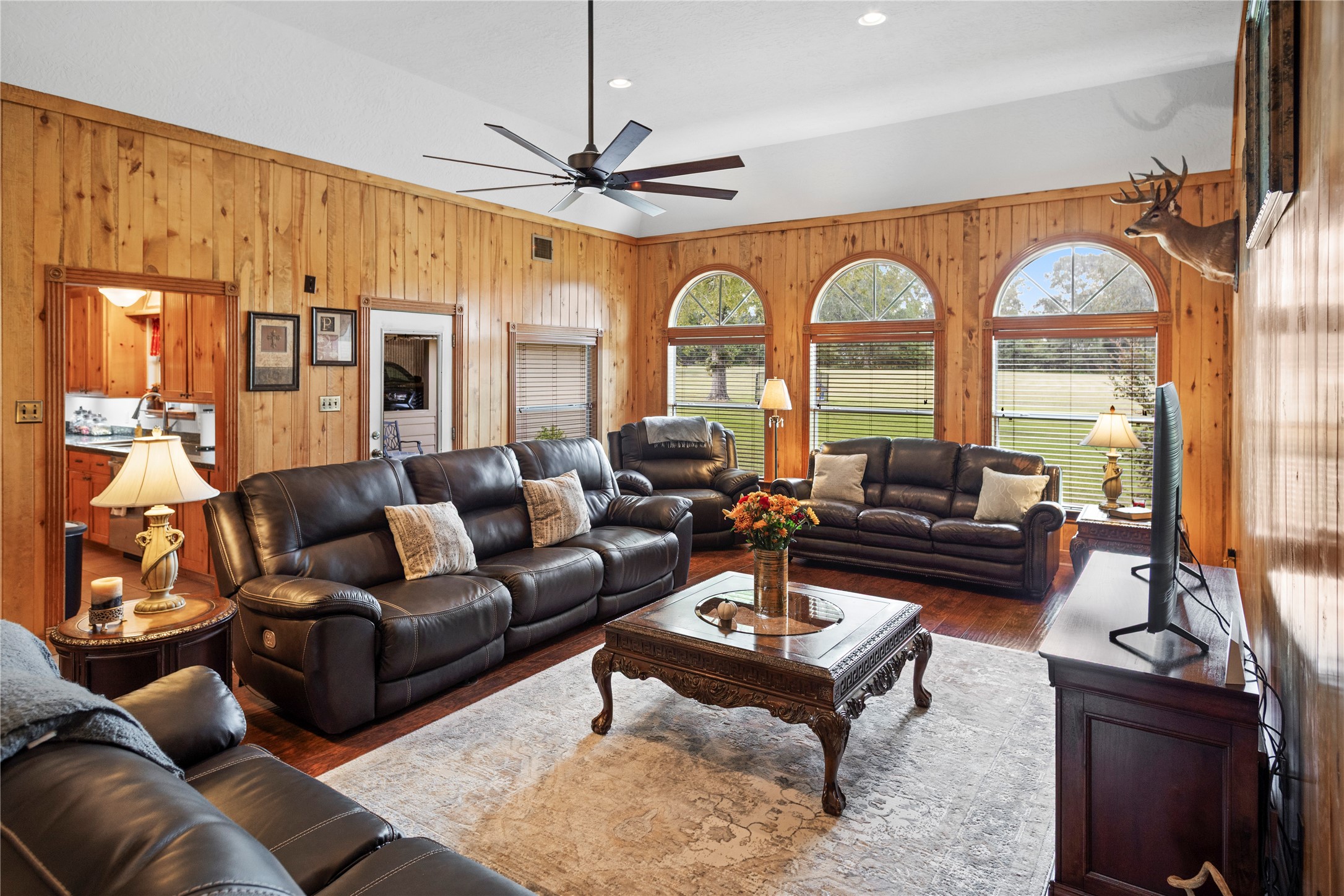 7875 Willys Road New Waverly, TX 77358 - Photo 13 of 45 a living room with furniture a chandelier and a fireplace