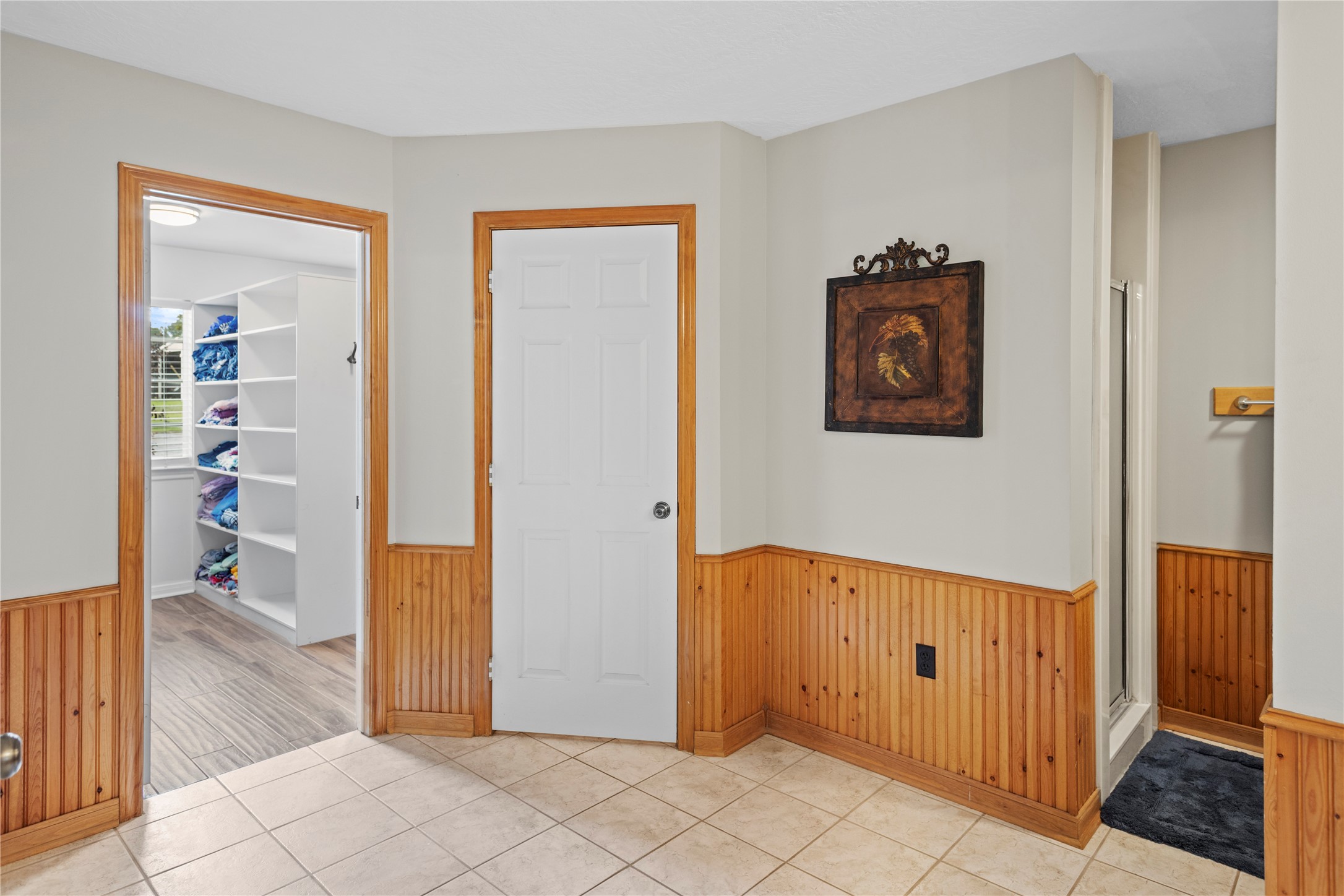 7875 Willys Road New Waverly, TX 77358 - Photo 22 of 45 a view of a hallway with wooden floor and a living room
