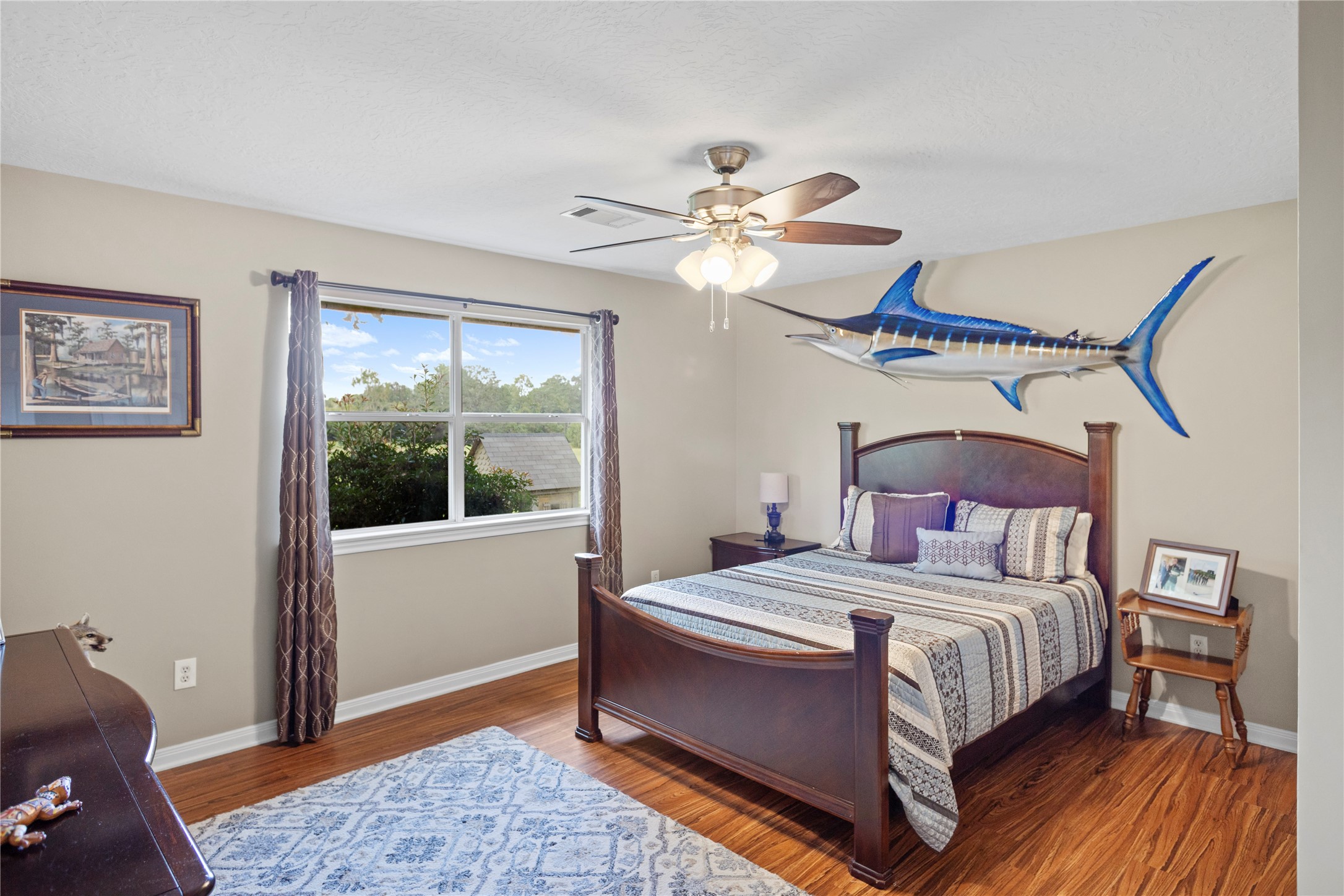 7875 Willys Road New Waverly, TX 77358 - Photo 24 of 45 a bedroom with a bed ceiling fan and a window