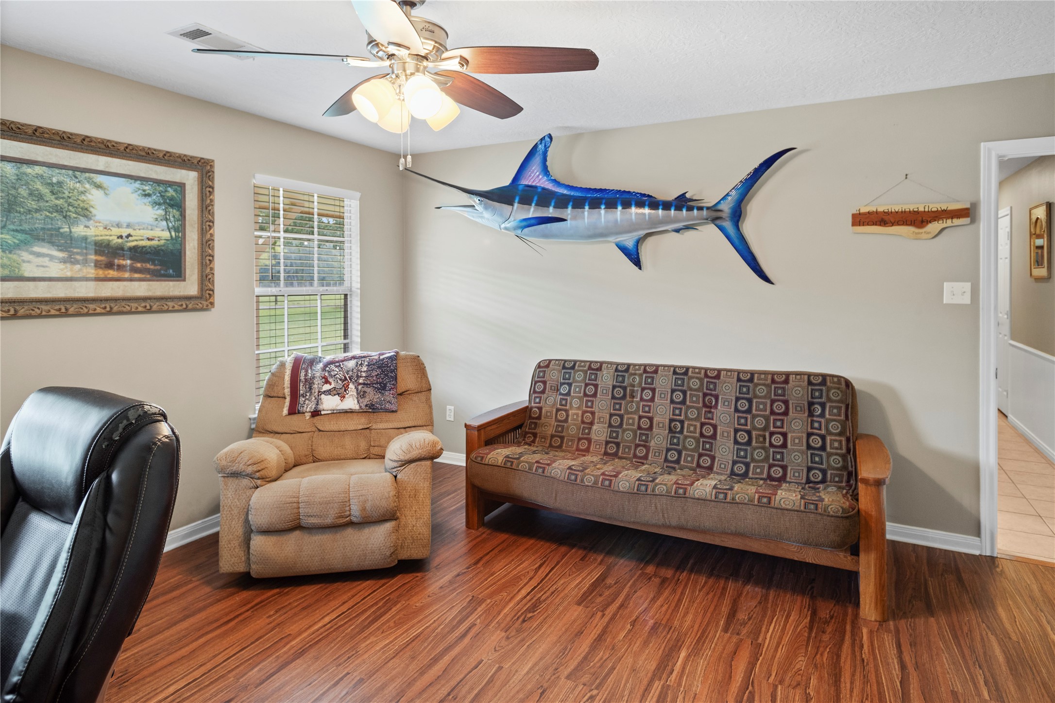 7875 Willys Road New Waverly, TX 77358 - Photo 31 of 45 a living room with furniture and a wooden floor