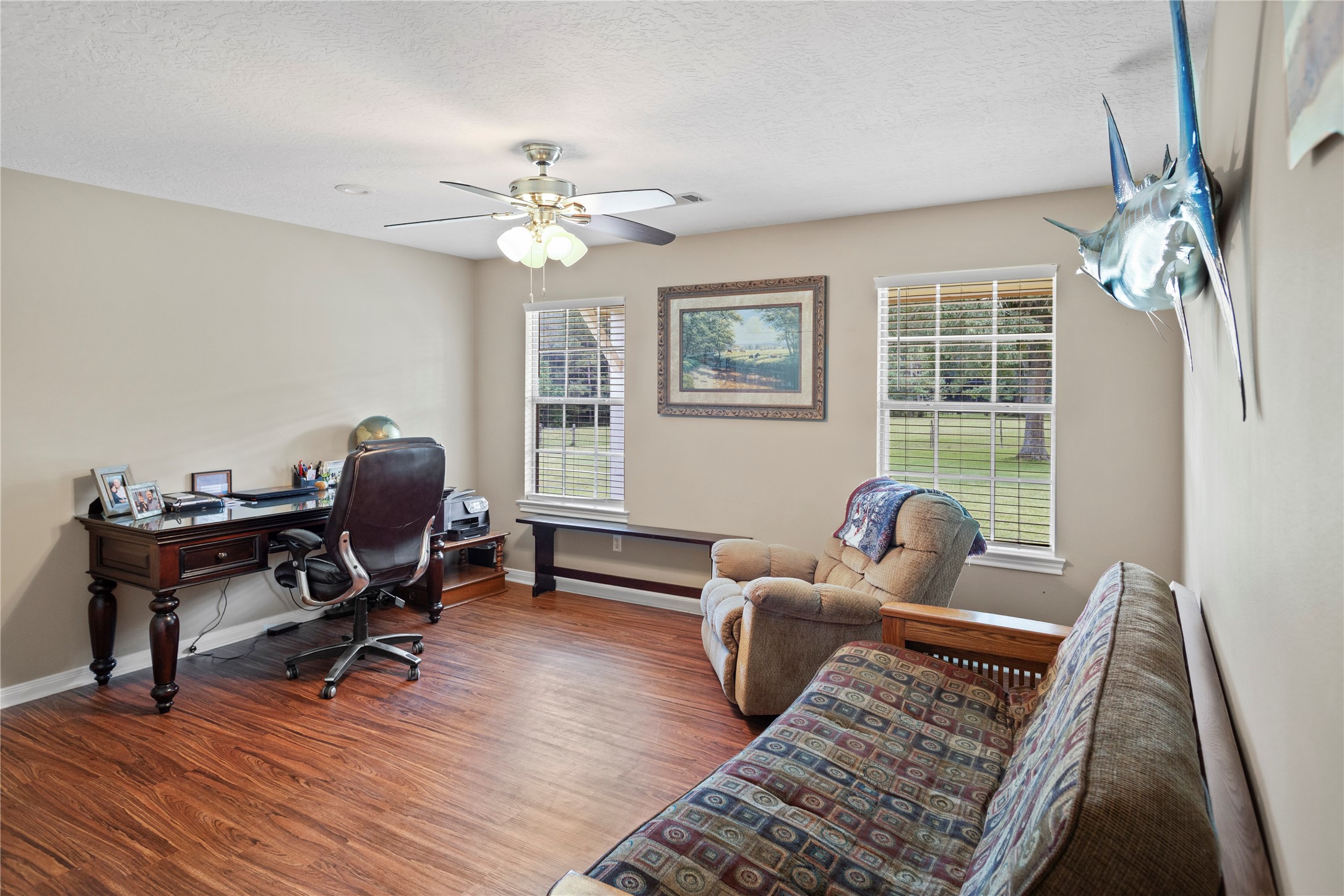 7875 Willys Road New Waverly, TX 77358 - Photo 32 of 45 a living room with furniture a chandelier and a rug