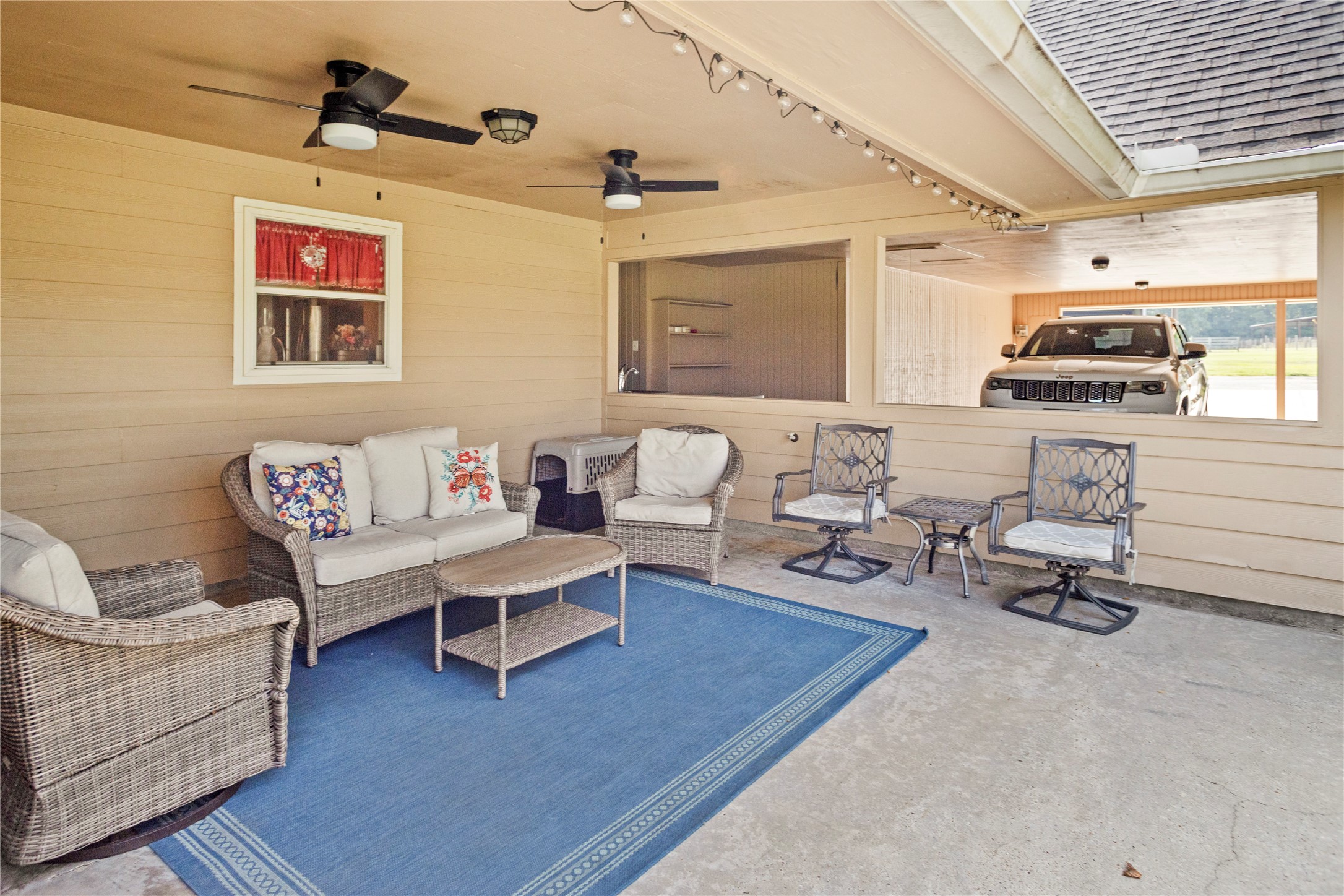 7875 Willys Road New Waverly, TX 77358 - Photo 35 of 45 a living room with furniture a rug and a window