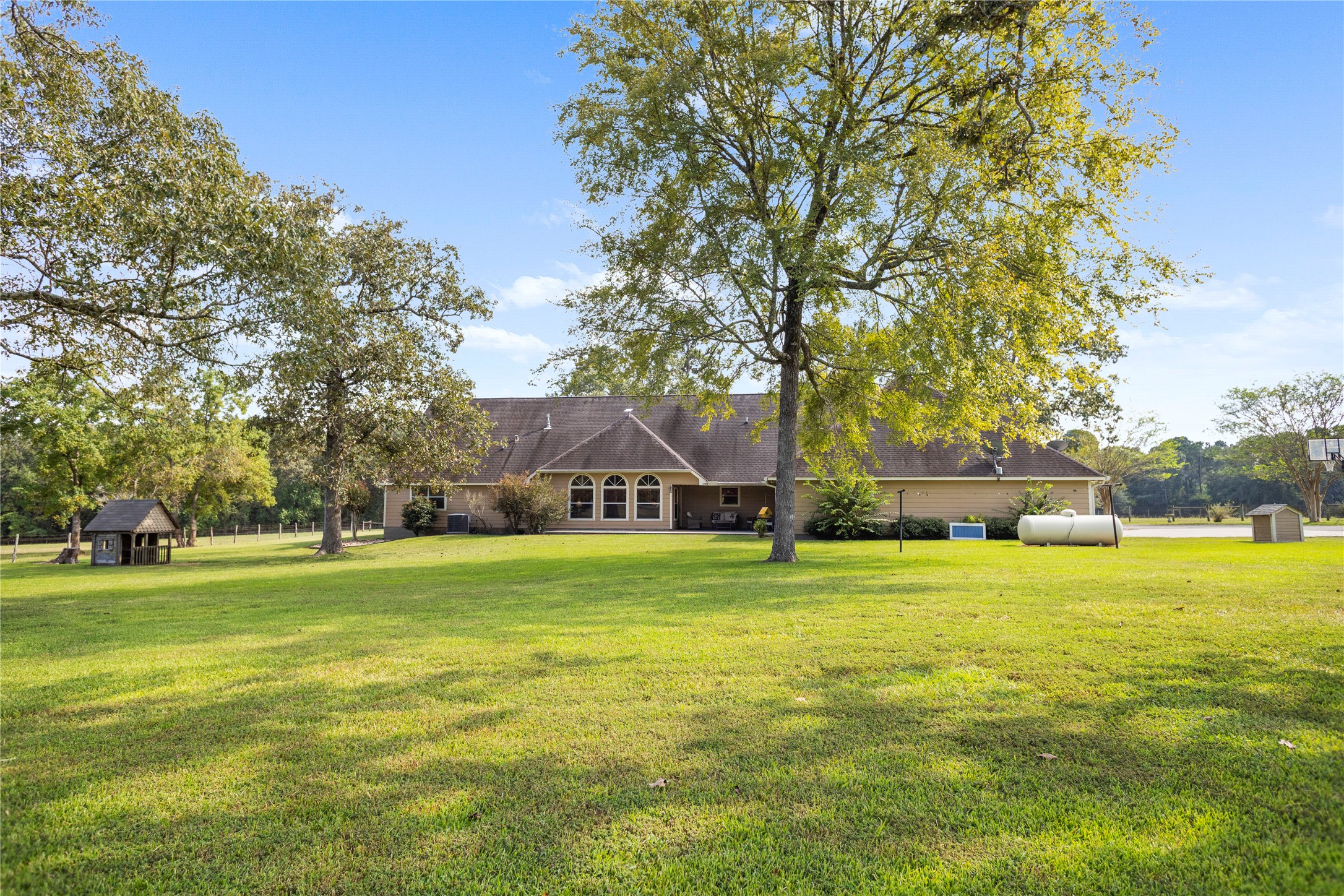 7875 Willys Road New Waverly, TX 77358 - Photo 36 of 45 a view of a big yard with a house and large trees