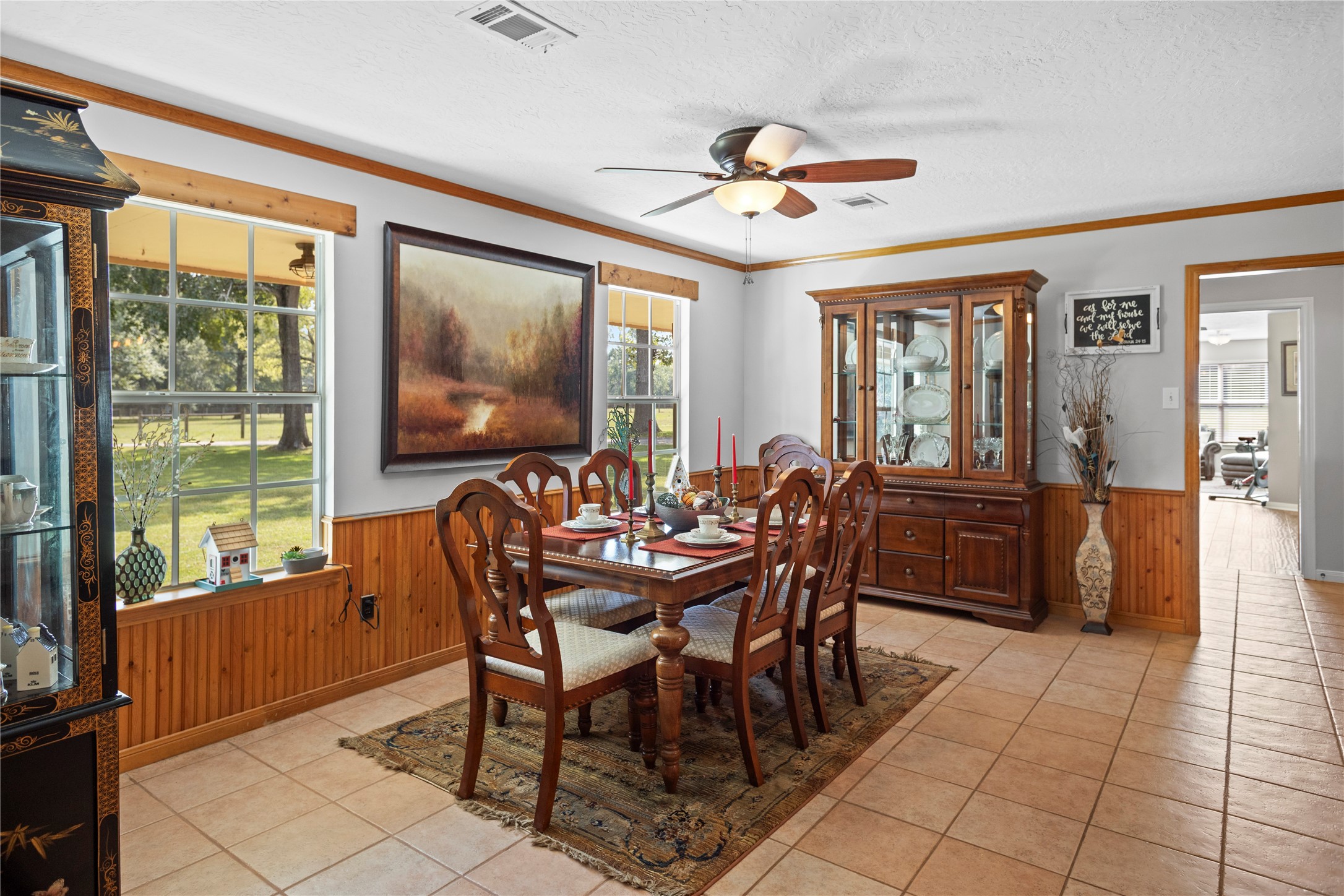 7875 Willys Road New Waverly, TX 77358 - Photo 8 of 45 a dining room with furniture a chandelier and wooden floor