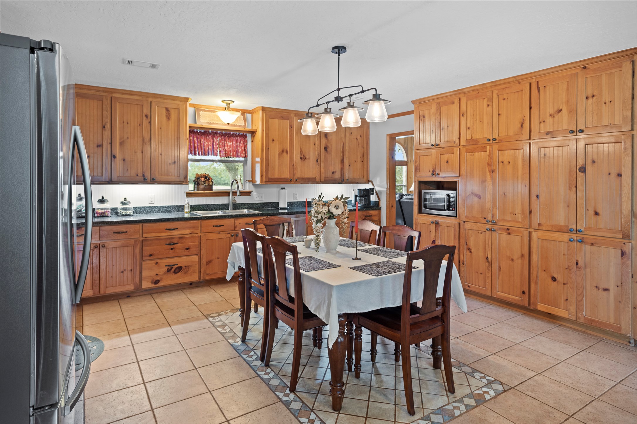 7875 Willys Road New Waverly, TX 77358 - Photo 10 of 45 a view of a dining room kitchen and a window