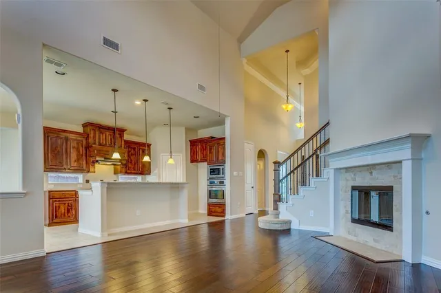 a view of kitchen with cabinets and wooden floor