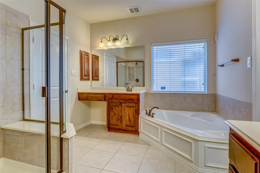 1180 Ranch Gate Lane Frisco, TX 75036 - Photo 17 of 40 a bathroom with a tub sink and mirror