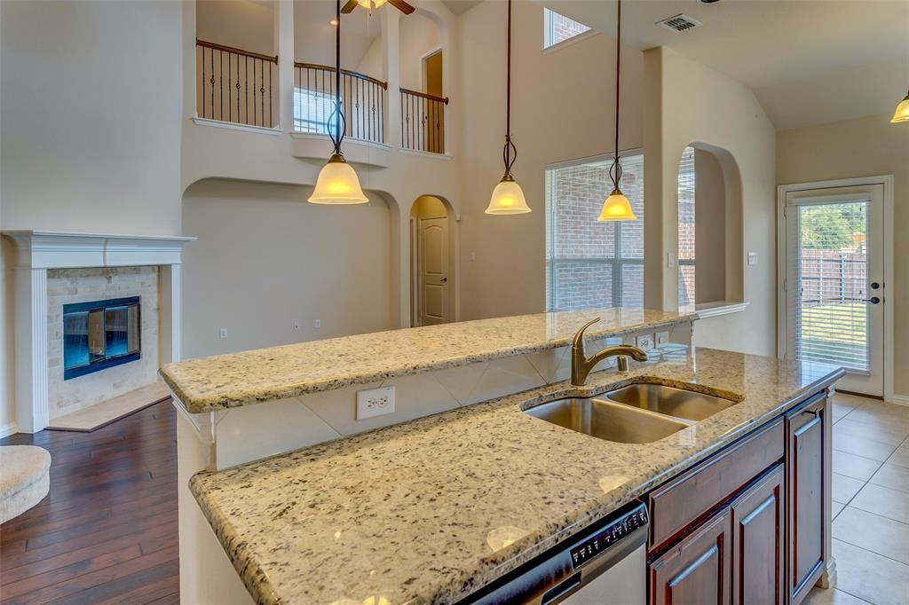 1180 Ranch Gate Lane Frisco, TX 75036 - Photo 21 of 40 a bathroom with a granite countertop sink and a mirror
