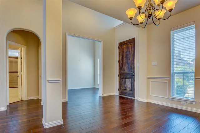 a view of an entryway with wooden floor