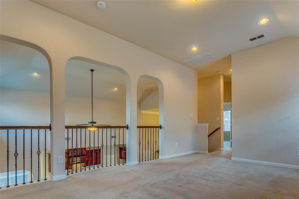 1180 Ranch Gate Lane Frisco, TX 75036 - Photo 34 of 40 a view of a hallway with a livingroom