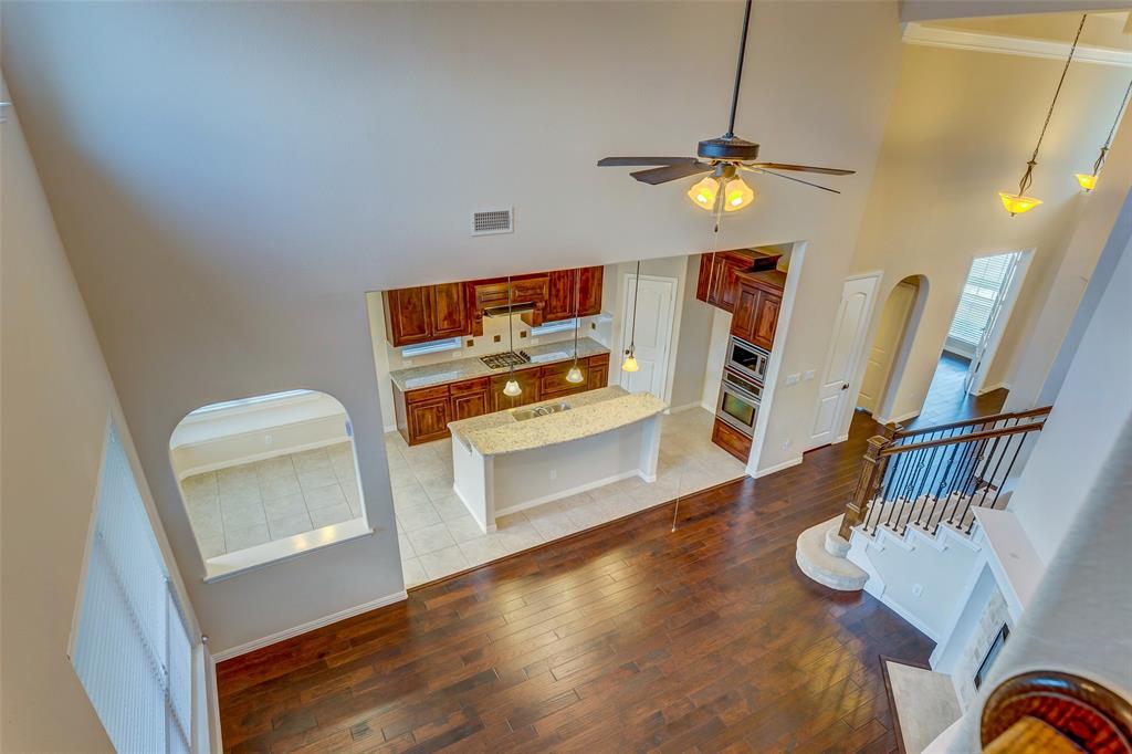 1180 Ranch Gate Lane Frisco, TX 75036 - Photo 38 of 40 a living room with furniture and a wooden floor