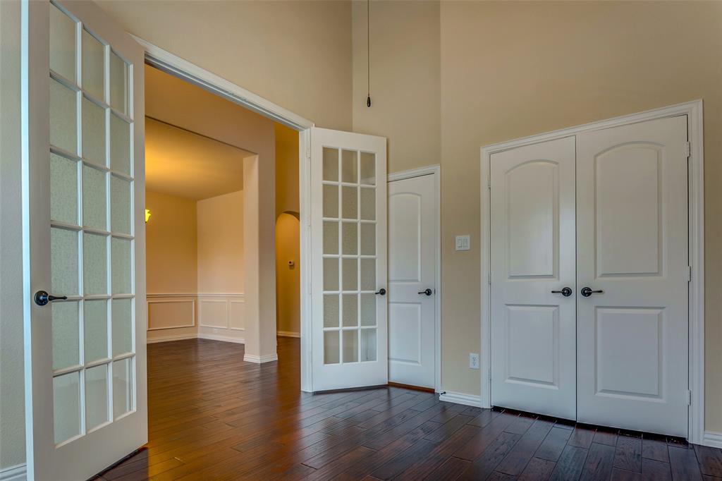1180 Ranch Gate Lane Frisco, TX 75036 - Photo 7 of 40 a view of empty room with wooden floor and closet