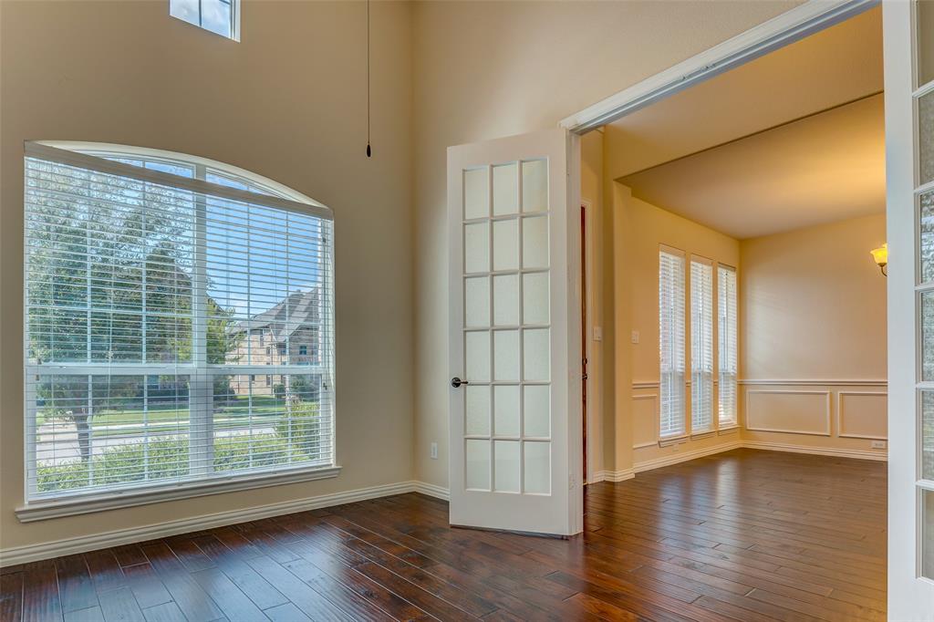 1180 Ranch Gate Lane Frisco, TX 75036 - Photo 8 of 40 a view of wooden floor and windows in a room