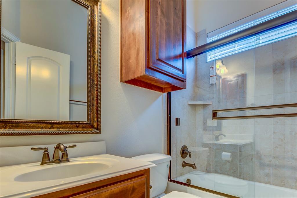 1180 Ranch Gate Lane Frisco, TX 75036 - Photo 9 of 40 a bathroom with a sink and a mirror