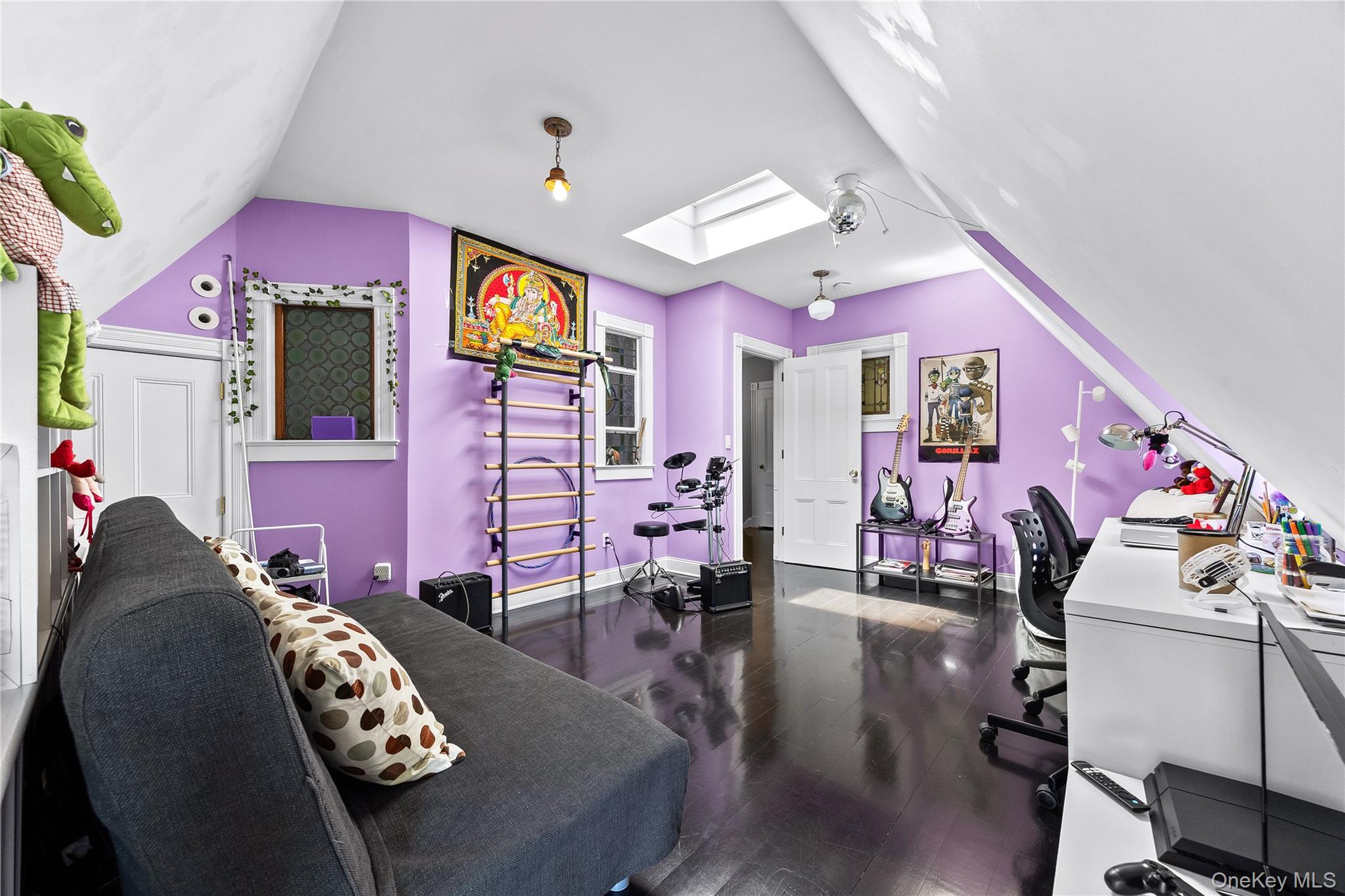19 Howe Place Bronxville, NY 10708 - Photo 26 of 37 Attic-level room featuring rich wood-finish flooring and a bright skylight