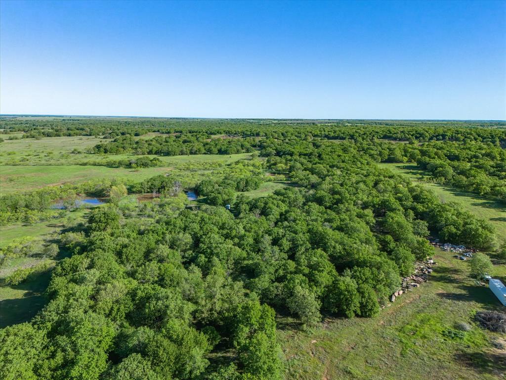 3760 Dewebber Road Bowie, TX 76230 - Photo 12 of 35 an aerial view of a houses with a yard