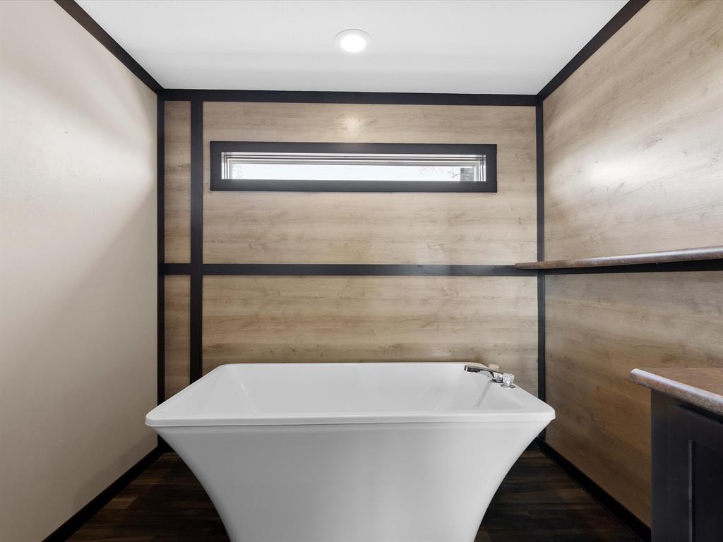 3760 Dewebber Road Bowie, TX 76230 - Photo 27 of 35 a bathroom with a bathtub